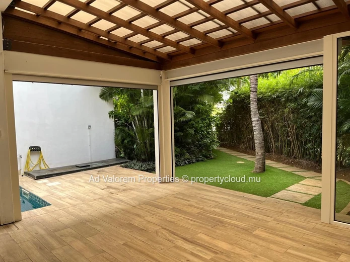 Exceptional corner apartment with private garden and heated swimming pool!