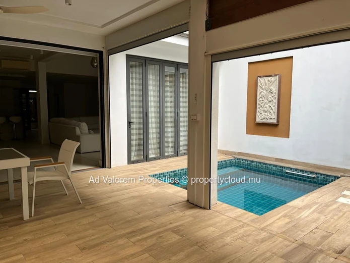 Exceptional corner apartment with private garden and heated swimming pool!